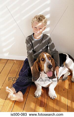 Stock Image - Boy with dog. Fotosearch