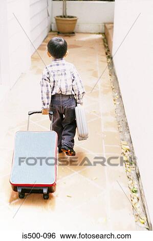 Boy with luggage View Large Photo Image Stock Photograph - Boy with luggage. Fotosearch