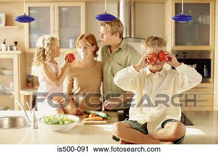 Stock Image - Family in the kitchen. Fotosearch