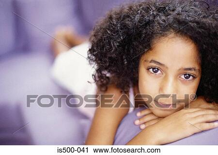 Girl lying on sofa View Large Photo Image Stock Image - Girl lying on sofa. Fotosearch