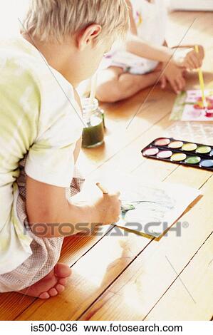 Stock Photograph - Girl painting. Fotosearch