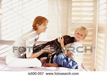 Stock Photo - Mother and son with dog. Fotosearch
