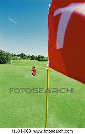Golf bag and flag View Large Photo Image Stock Photo - Golf bag and flag. Fotosearch