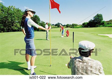 Man and woman playing golf View Large Photo Image Stock Image - Man and woman playing golf. Fotosearch