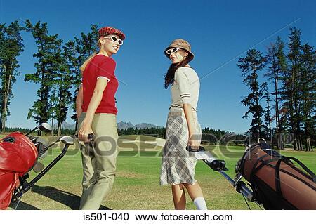 Man and woman playing golf View Large Photo Image Stock Image - Man and woman playing golf. Fotosearch