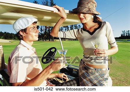 Man and woman playing golf View Large Photo Image Stock Image - Man and woman playing golf. Fotosearch