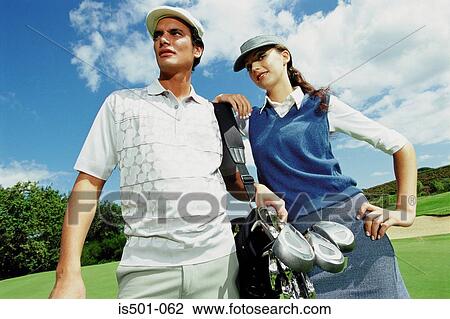 Man and woman playing golf View Large Photo Image Stock Image - Man and woman playing golf. Fotosearch