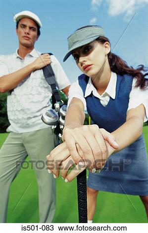 Man and woman playing golf View Large Photo Image Stock Image - Man and woman playing golf. Fotosearch