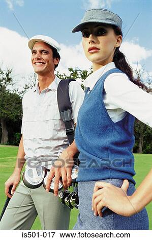 Man and woman playing golf View Large Photo Image Stock Photo - Man and woman playing golf. Fotosearch