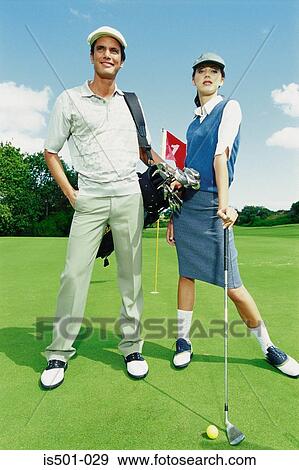 Man and woman playing golf View Large Photo Image Stock Photo - Man and woman playing golf. Fotosearch