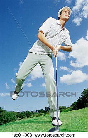 Stock Image - Man playing golf. Fotosearch