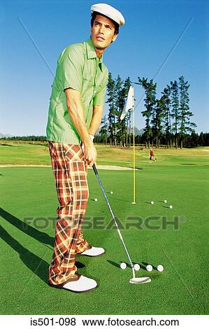 Stock Photo - Man playing golf. Fotosearch