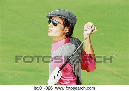Stock Photograph - Man playing golf. Fotosearch