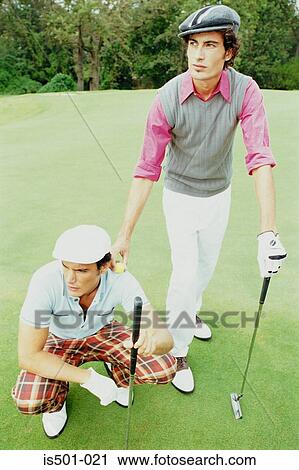 Stock Image - Men playing golf. Fotosearch