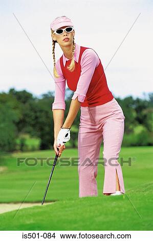 Woman playing golf View Large Photo Image Picture - Woman playing golf. Fotosearch