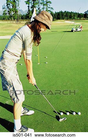 Woman playing golf View Large Photo Image Stock Image - Woman playing golf. Fotosearch