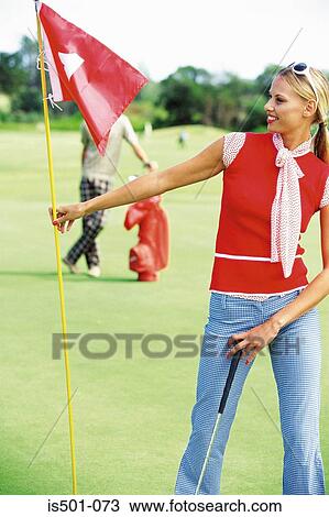 Woman playing golf View Large Photo Image Stock Image - Woman playing golf. Fotosearch