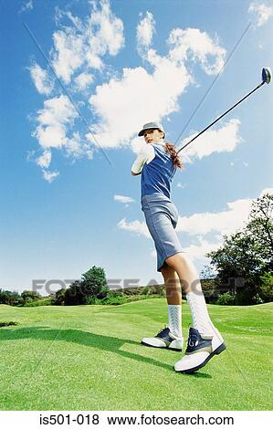 Stock Photo - Woman playing golf. Fotosearch