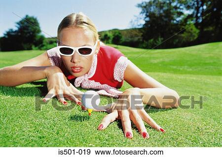 Stock Photo - Woman playing golf. Fotosearch