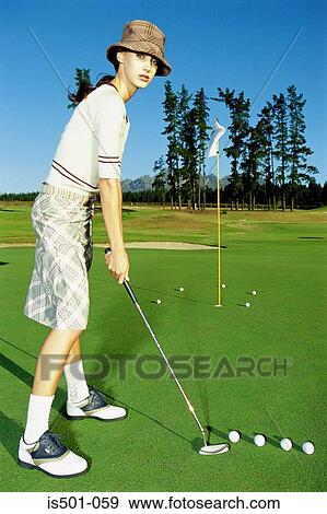 Stock Photo - Woman playing golf. Fotosearch