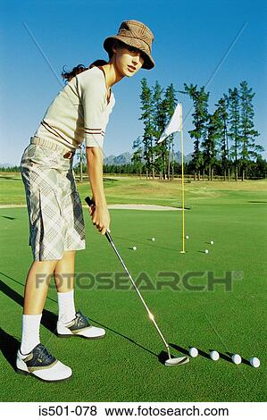 Woman playing golf View Large Photo Image Stock Photo - Woman playing golf. Fotosearch