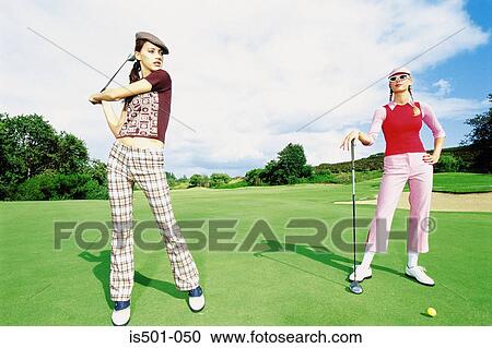 Women playing golf View Large Photo Image Stock Image - Women playing golf. Fotosearch