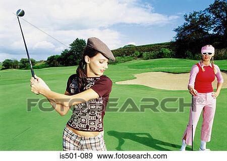 Stock Photo - Women playing golf. Fotosearch