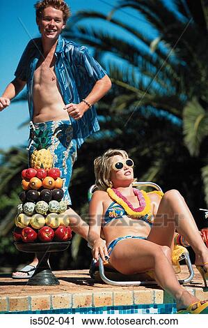 Fruit and sunbathing by the pool View Large Photo Image Stock Image - Fruit and sunbathing by the pool. Fotosearch