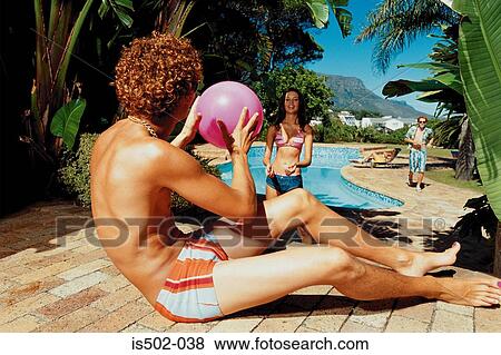 Stock Photo - Playing by the pool. Fotosearch