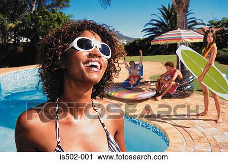 Young woman sunbathing View Large Photo Image Stock Image - Young woman sunbathing. Fotosearch