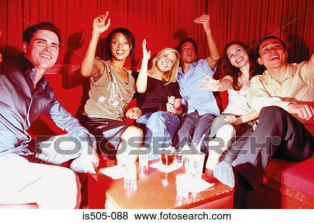 Stock Photo - Friends in nightclub. Fotosearch