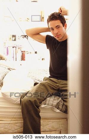 Stock Image - Man undressing. Fotosearch