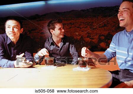 Men having a drink View Large Photo Image Stock Photo - Men having a drink. Fotosearch