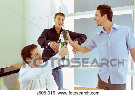 Stock Photograph - Men having a drink. Fotosearch
