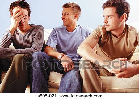 Men joking around on sofa View Large Photo Image Stock Image - Men joking around on sofa. Fotosearch