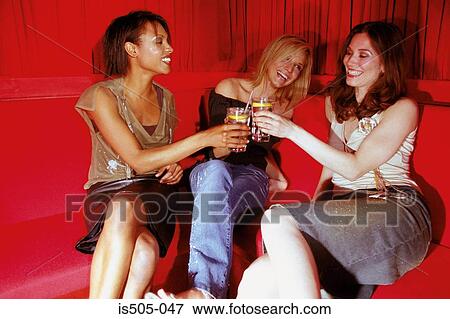 Stock Photo - Women having a drink. Fotosearch
