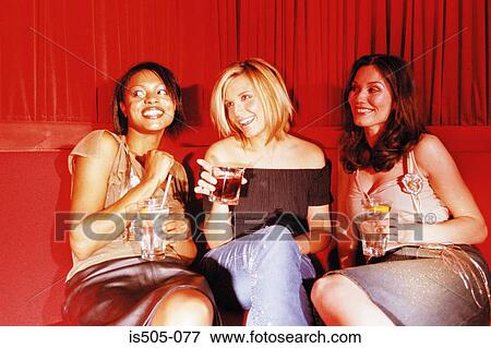 Women having a drink View Large Photo Image Stock Photo - Women having a drink. Fotosearch