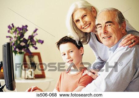 Grandparents and grandson using computer View Large Photo Image Stock Photo - Grandparents and grandson using computer. Fotosearch