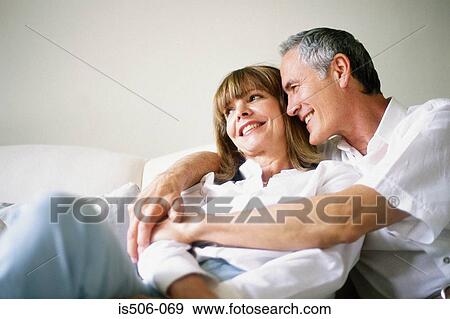 Man and woman together on sofa View Large Photo Image Stock Photo - Man and woman together on sofa. Fotosearch