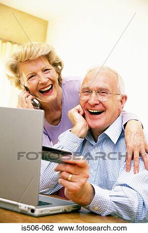 Man and woman using laptop computer View Large Photo Image Stock Image - Man and woman using laptop computer. Fotosearch