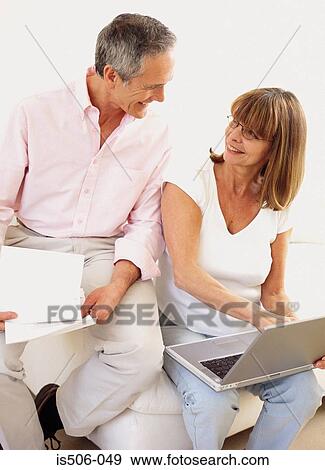Man and woman using laptop computer View Large Photo Image Stock Photo - Man and woman using laptop computer. Fotosearch