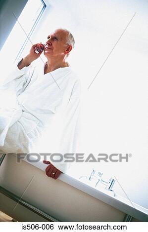 Man talking on cellphone View Large Photo Image Stock Photograph - Man talking on cellphone. Fotosearch