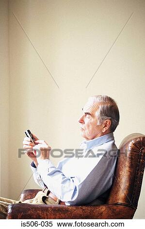 Man using cellphone View Large Photo Image Stock Photography - Man using cellphone. Fotosearch