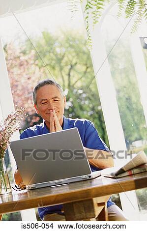 Man using laptop computer View Large Photo Image Picture - Man using laptop computer. Fotosearch