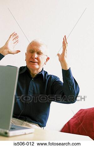 Man using laptop computer View Large Photo Image Stock Image - Man using laptop computer. Fotosearch