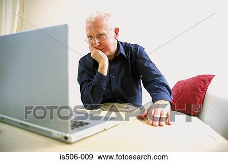 Man using laptop computer View Large Photo Image Stock Photo - Man using laptop computer. Fotosearch