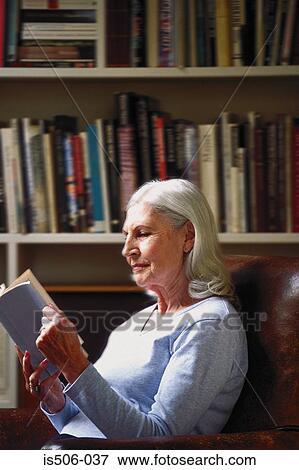 Woman reading in study View Large Photo Image Stock Photo - Woman reading in study. Fotosearch