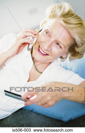 Stock Image - Woman talking on cellphone. Fotosearch