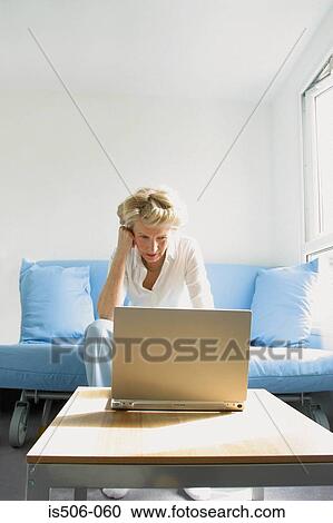 Woman using laptop computer View Large Photo Image Stock Image - Woman using laptop computer. Fotosearch