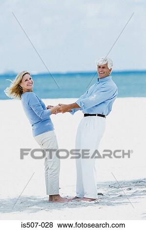 Stock Photo - Couple by the sea . Fotosearch